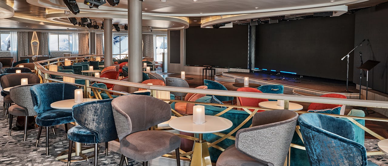 The Explorer Lounge serves as the central hub for coordinating shore excursions while on board