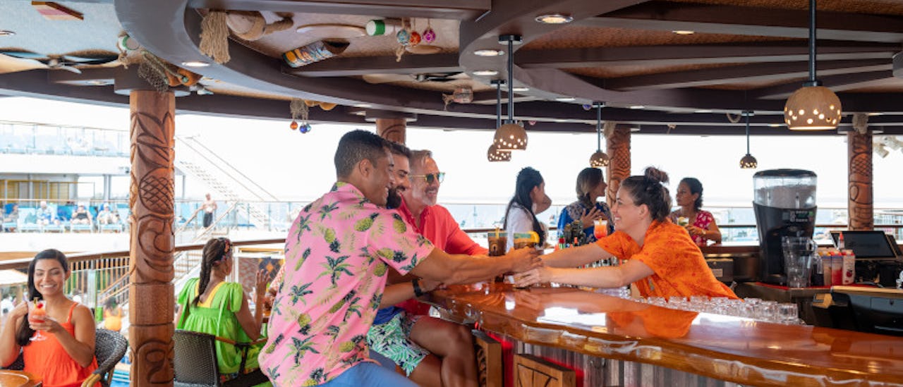 Red Frog Tiki bar - sip a Polynesian Punch or try a Jungle Bird! This poolside bar spans two decks and transports you right to the land of Tiki.