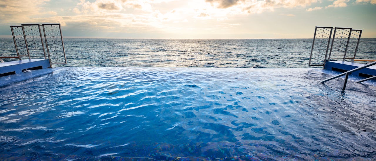 Step into the infinity pool adjacent to the Spa
